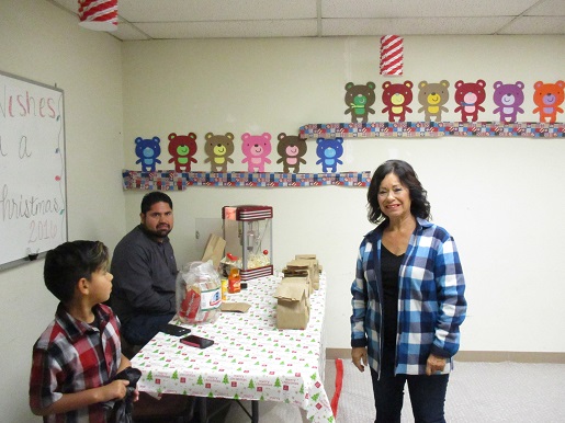 Luis and his family are at the Popcorn Palace